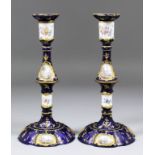 A good pair of late 18th Century South Staffordshire enamel pillar candlesticks, with wavy rims to