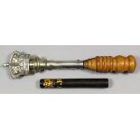 A tipstaff, the crown and central shaft of plated brass on a turned hardwood handle, 5.25ins (