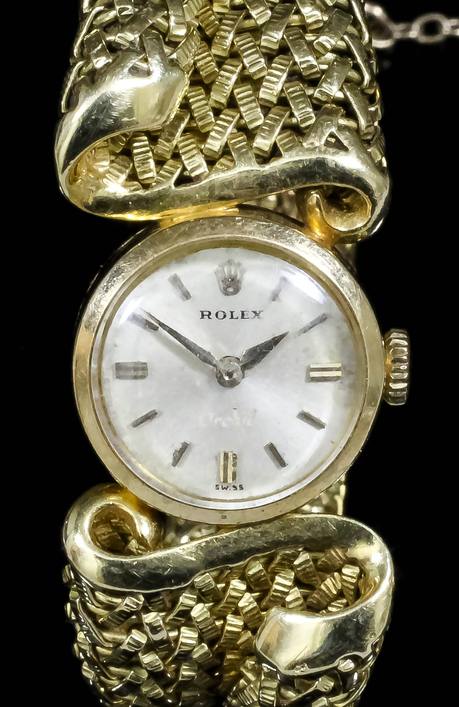 A 1960s lady's 18ct gold  Rolex wristwatch, the white dial with baton numerals, contained in plain