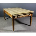 A Victorian stripped pine rectangular kitchen table fitted two frieze drawers, on square tapered