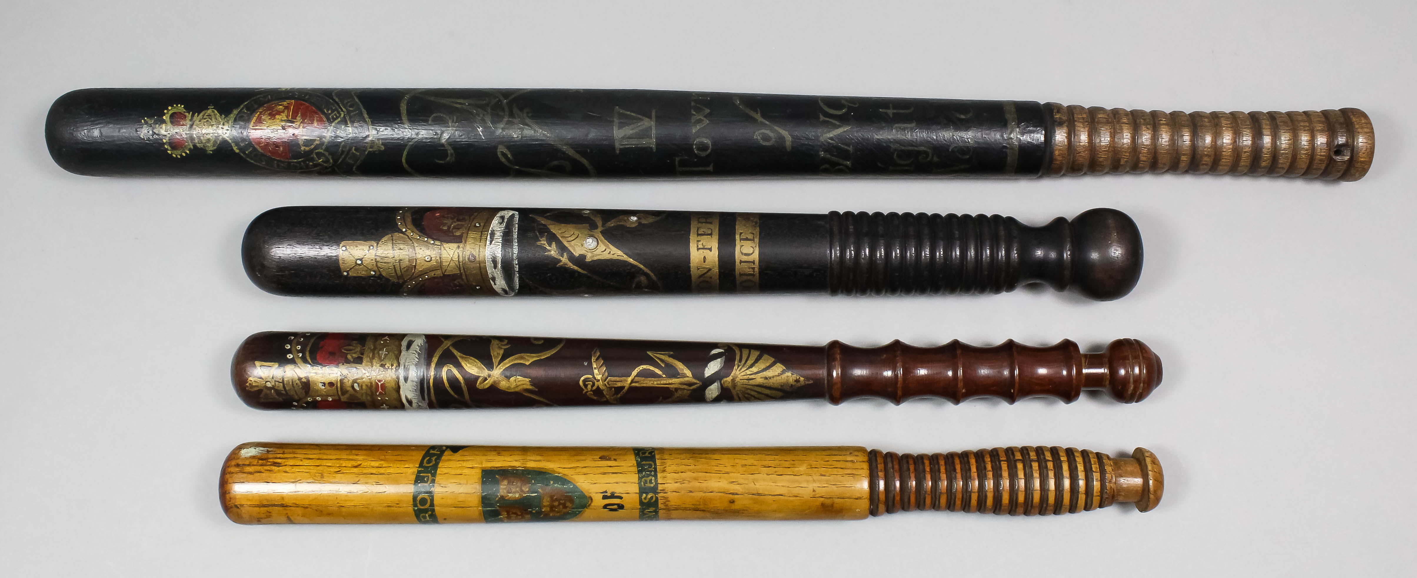A George IV turned wood long truncheon painted with royal arms with supporters above the royal
