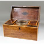 A late Georgian mahogany and crossbanded tea caddy of rectangular shape, the fitted interior with