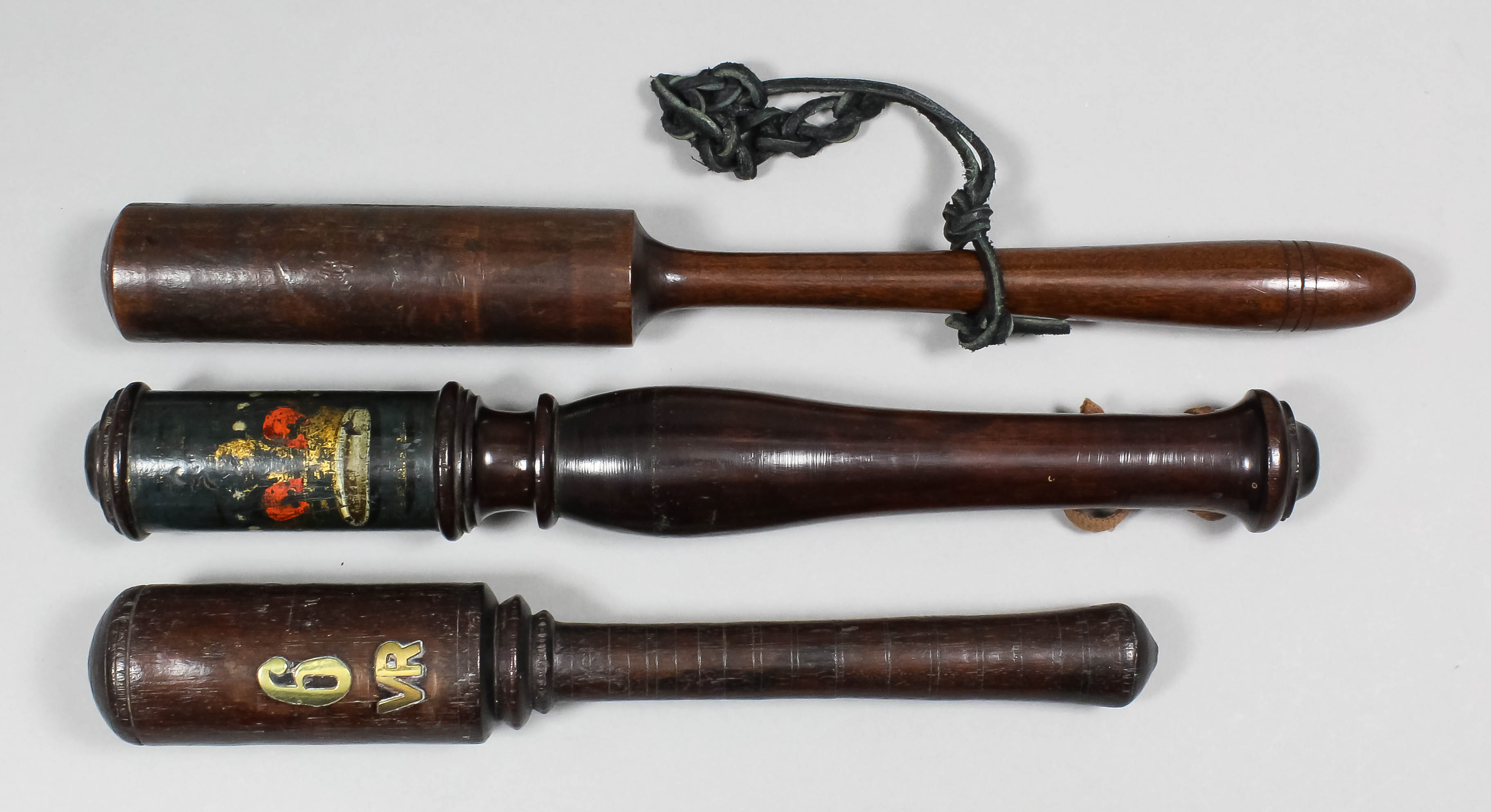 A George III  turned mahogany tipstaff painted with a crown and a royal monogram (indistinct), 12.