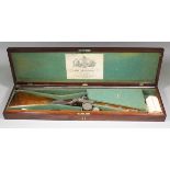 A cased 19th Century single barrel percussion 10 bore fowling piece by Charles Lancaster, New Bond