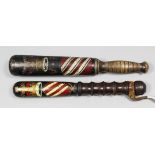 A Victorian turned wood truncheon painted with a crown over "VR" above the Manchester arms and