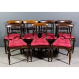 A set of seven George IV rosewood dining chairs with plain curved crest rails, fretted and carved