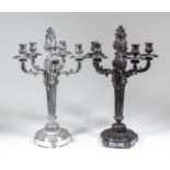 A pair of George V silver five light candelabra of Louis XVI design, the centre column surmounted by