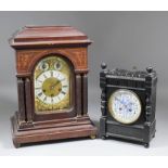 A late 19th Century German mahogany cased mantel clock by Junghans, the rectangular brass dial