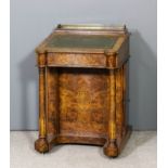 A Victorian figured walnut Davenport inlaid with boxwood stringings and arabesques, the upper part