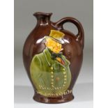 A Royal Doulton Dewars Whisky Kingswear pottery bulbous flask decorated with shoulder-length