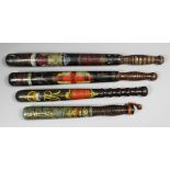 A Victorian turned wood truncheon painted with the royal cipher above a crown, with arms of