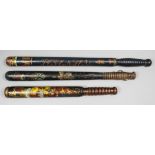 A Victorian (?) turned wood truncheon painted with a crown over the royal arms centred with the arms