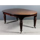 *A late Victorian mahogany circular extending dining table with one extra leaf, with moulded edge to