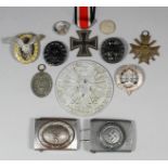 A collection of World War II German military badges and medals, comprising - six Iron Crosses, two