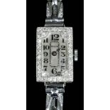 A 1930s lady's platinum and diamond Benson cocktail watch, the silvered dial with Arabic numerals,