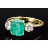 A modern 18ct gold mounted emerald and diamond ring, the square cut emerald approximately 1ct