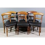 A set of six Victorian mahogany dining chairs with deep curved crest rails and plain splats, the