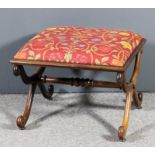 A William IV rosewood framed rectangular stool, the seat upholstered in red floral cloth, on X-