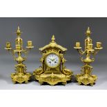 A late 19th Century French gilt brass cased three piece clock garniture, the clock by Japy Freres,