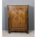 An 18th Century French oak dwarf cupboard with moulded edge to top and rounded front corners, fitted