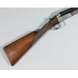 A 12 bore side by side shotgun by E.J. Churchill, Serial No. 7262, with 25ins blued steel barrels