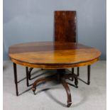 A 19th Century mahogany extending dining table inlaid with ebony stringings, comprising two D-shaped
