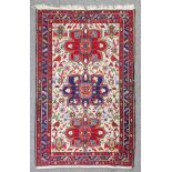 A modern Persian Sumac rug woven in colours with three bold shaped medallions, the field filled with