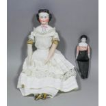 A mid 19th Century German porcelain headed doll with cloth body and porcelain lower arms and legs,