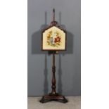 A William IV mahogany framed rectangular pole screen with shaped and carved top and inset with