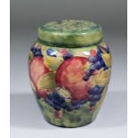 An early 20th Century Moorcroft pot-pourri vase and cover, finely tube lined with "Pomegranate"