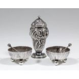 A pair of Victorian silver circular salts with reeded bodies and each on three ball feet, 1.875ins