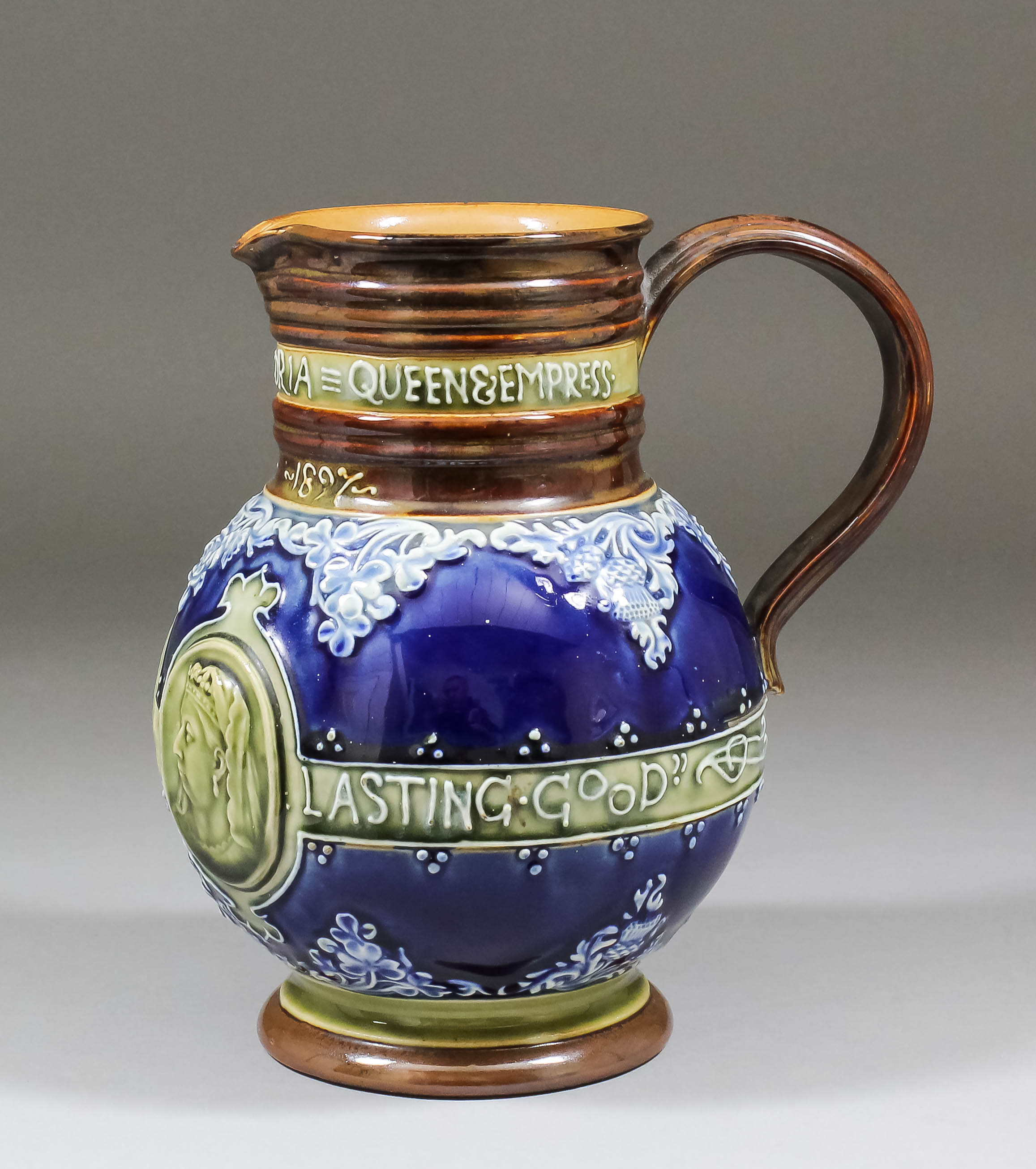 A late 19th Century Doulton stoneware jug commemorating Queen Victoria's Diamond Jubilee of 1897,