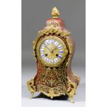 A late 19th Century French red tortoise-shell, Boulle and gilt brass mounted mantel clock of Louis