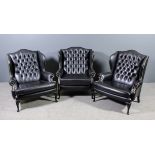 A pair of modern wing back easy chairs of large proportions and of "18th Century" design, with