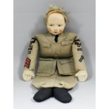 A Second World War Chad Valley felt and cloth headed doll, the painted head with blond curly hair