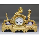 A late 19th Century French gilt metal and porcelain mounted cased mantel clock, the 3.75ins diameter