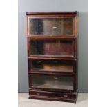 A Globe Wernicke stained wood four tier sectional bookcase, each tier enclosed by a rising glazed