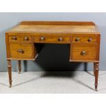 A mahogany kneehole desk with tan tooled leather inset to top, fitted five drawers on turned and