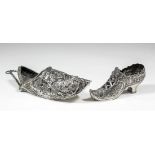 An Edward VII silver wall pocket in the form of a pointed shoe, cast with figures on horseback and