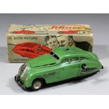 A Schuco Kommando Anno 2000 clockwork car in green finish, complete with key, and box for same