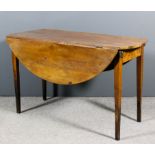 A 19th Century French cherrywood circular drop-leaf dining table, on square tapered legs, 50ins