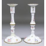 A pair of late 18th Century South Staffordshire enamel pillar candlesticks, with wavy rims to the