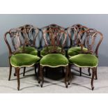 A set of six Victorian rosewood  drawing room chairs, the shaped and moulded backs with pierced