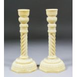 A good pair of 19th Century Anglo Indian engine turned ivory candlesticks, the spiral pattern column