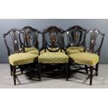 A set of six late Victorian mahogany shield back dining chairs of "Hepplewhite" design, the