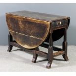 An old oak oval gateleg table, fitted one frieze drawer, on turned supports with splayed feet, 40.