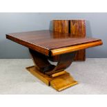 A 1930s Continental rosewood rectangular extending dining table of Art Deco design, with two extra