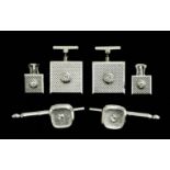 A pair of modern gentleman's 18ct white gold and diamond set square faced engine turned pattern