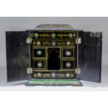 A Victorian black lacquer, mother of pearl and gilt decorated table cabinet, the lid enclosing