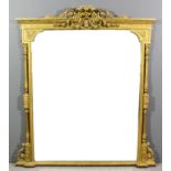 A 19th Century gilt framed overmantel mirror with bold leaf scroll and floral swag cresting, the